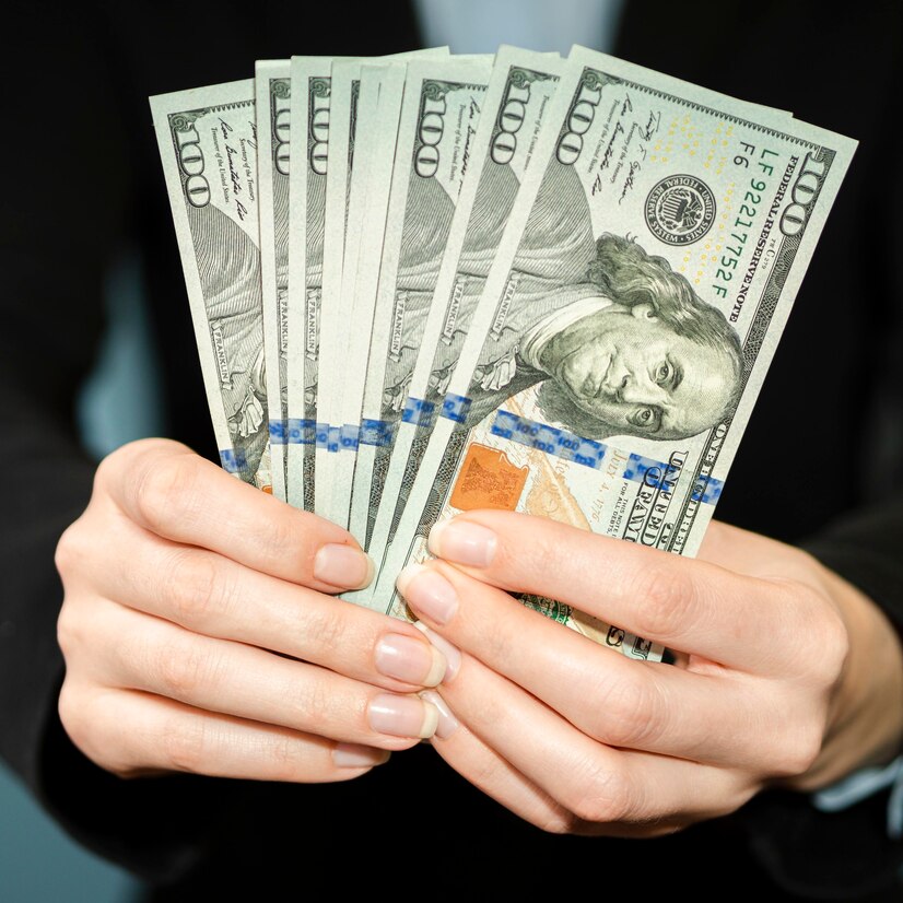 front-view-person-holding-money_23-2148547904